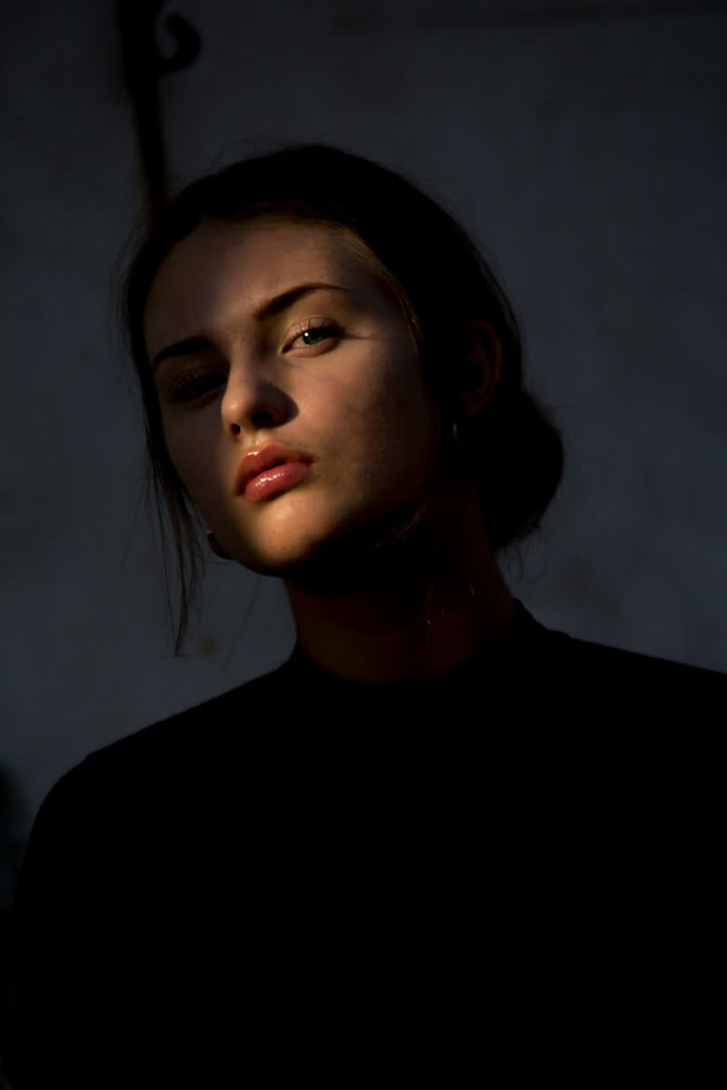 woman wearing black crew-neck top