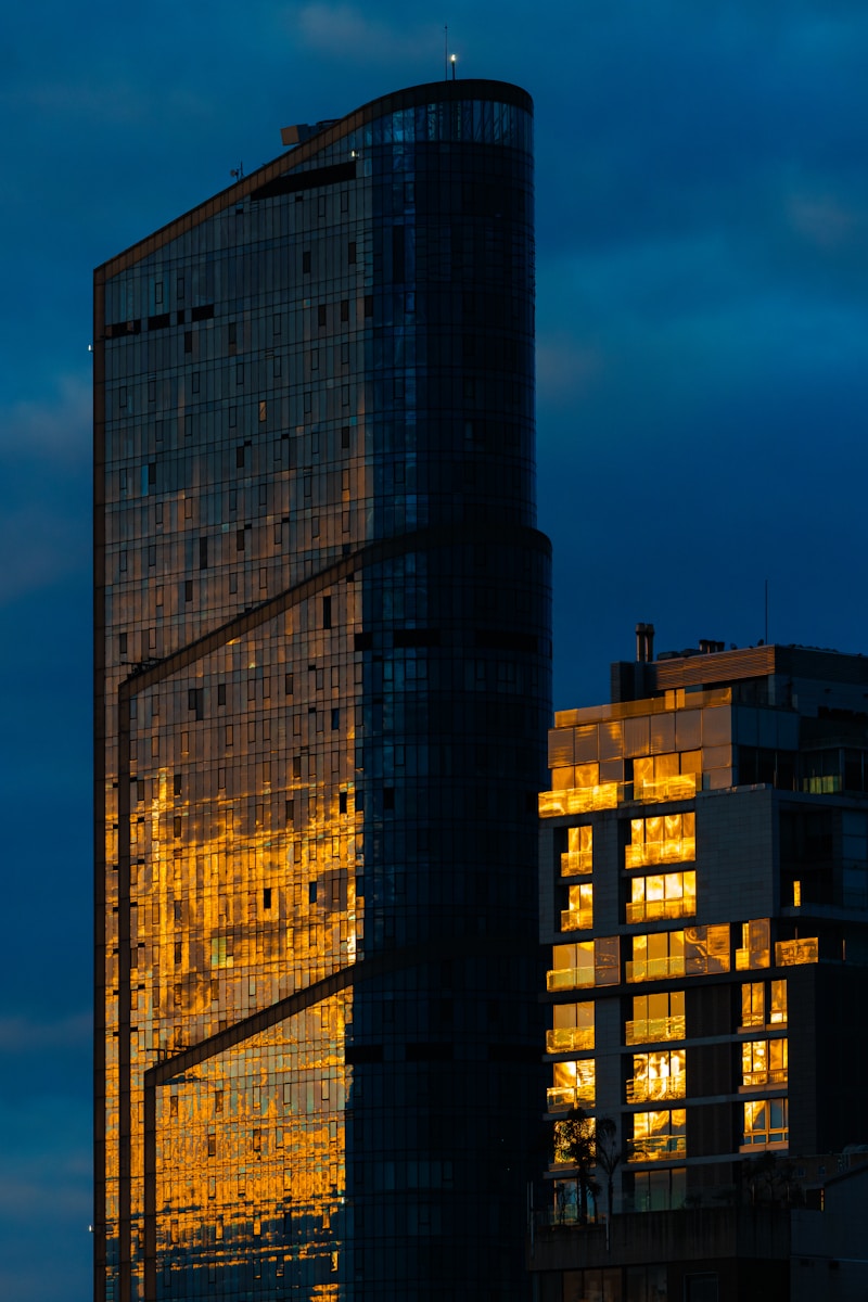 A very tall building sitting next to a tall building