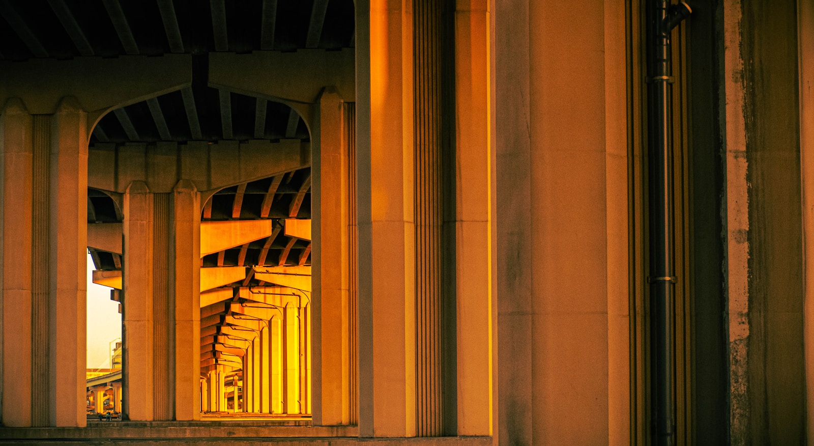 A building with columns and a clock on the side of it